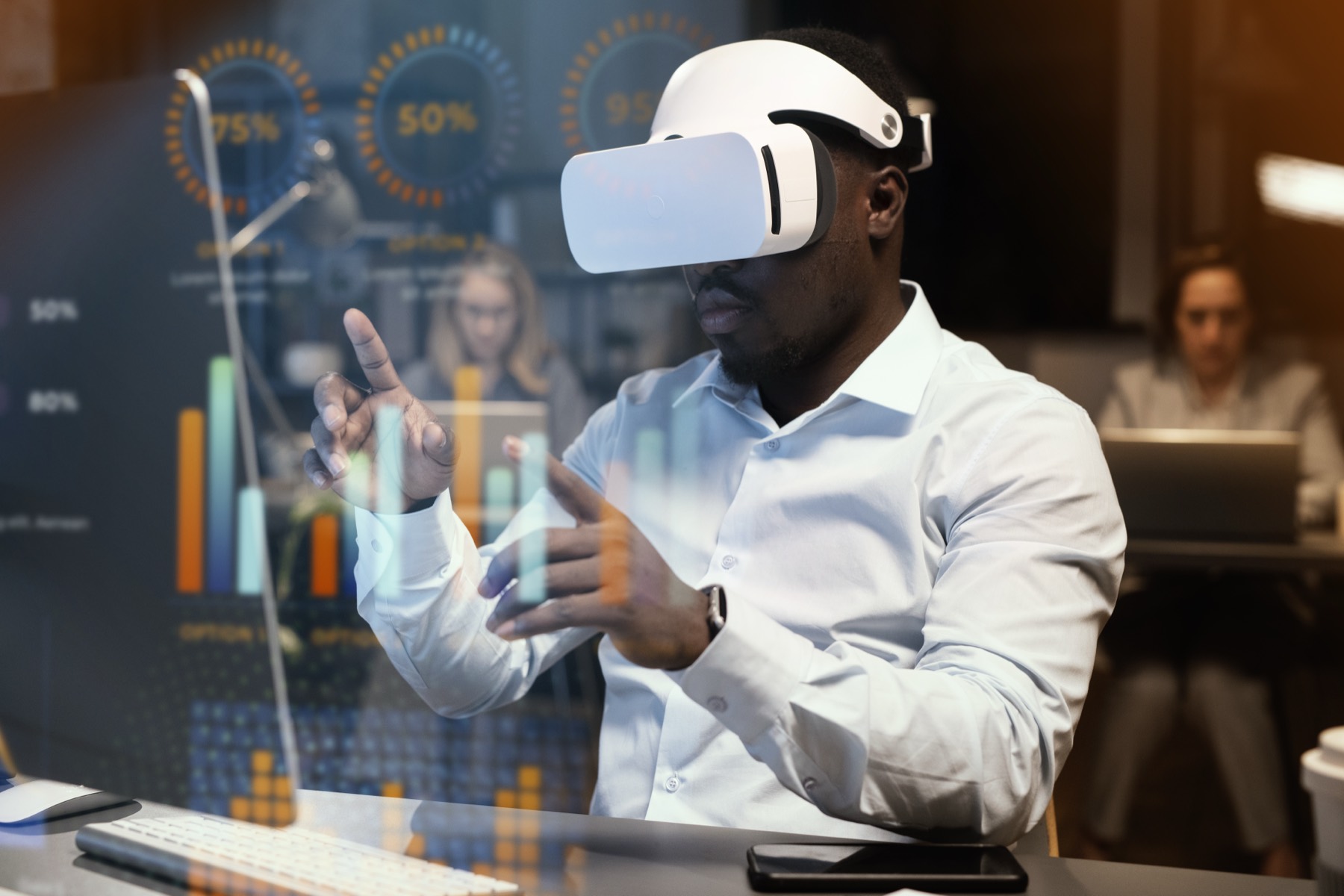 A professional wearing a VR headset gestures at holographic bar and donut charts in an office.